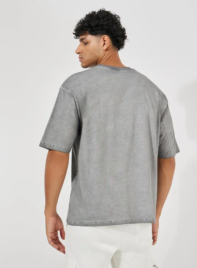 Styli Overdyed Washed Oversized T-Shirt with Slogan Print