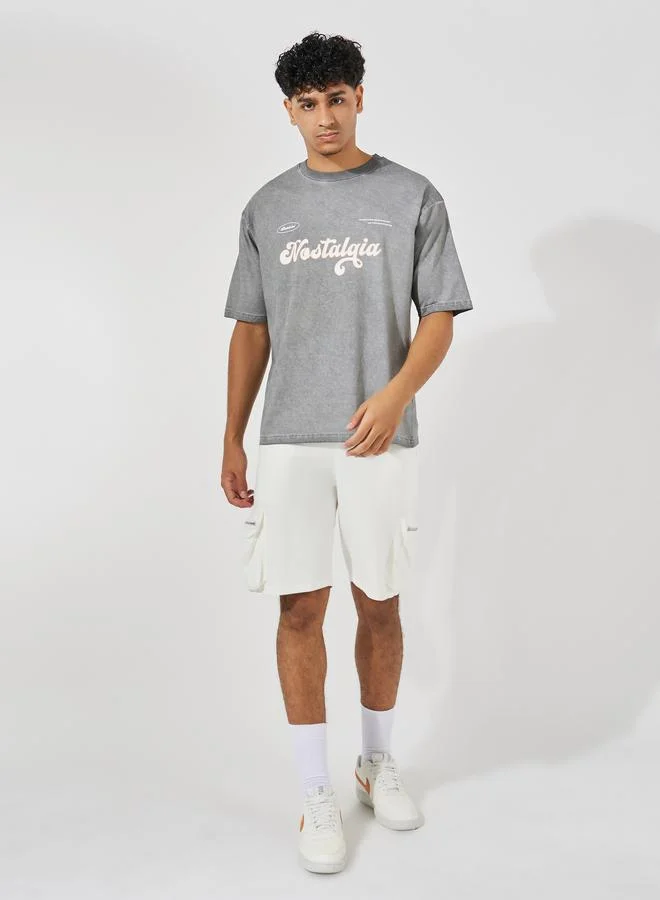 Styli Overdyed Washed Oversized T-Shirt with Slogan Print