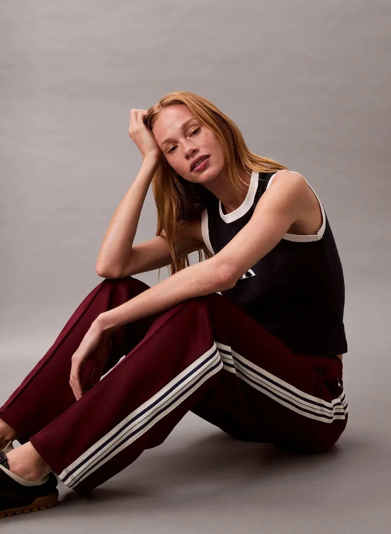 Calvin Klein Jeans Deep Rouge High Shine French Terry Track Pants for Women | Best Price UAE