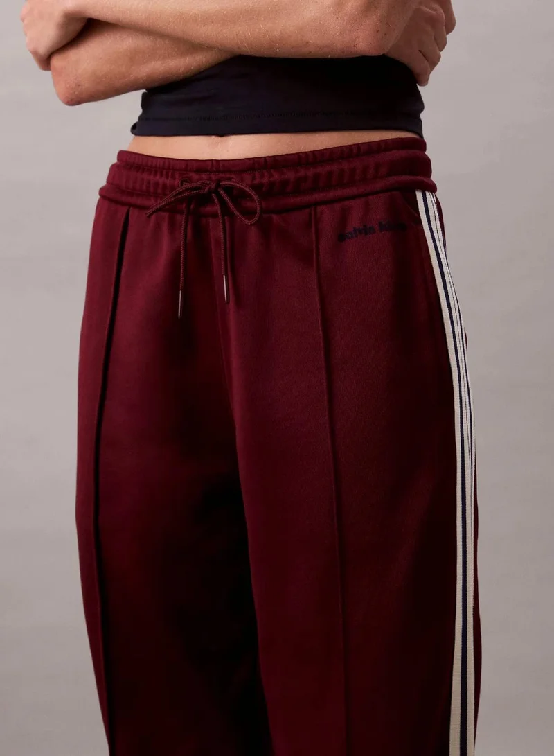 Calvin Klein Jeans Deep Rouge High Shine French Terry Track Pants for Women | Best Price UAE