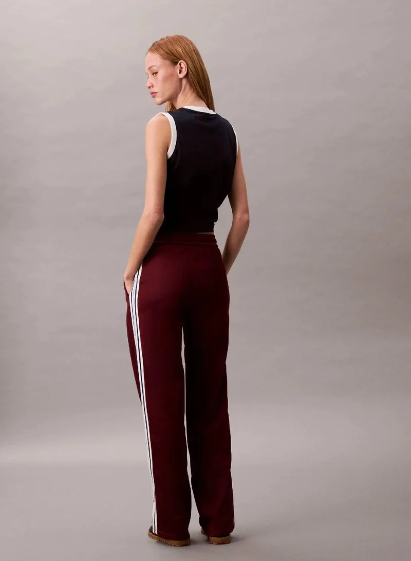 Calvin Klein Jeans Deep Rouge High Shine French Terry Track Pants for Women | Best Price UAE