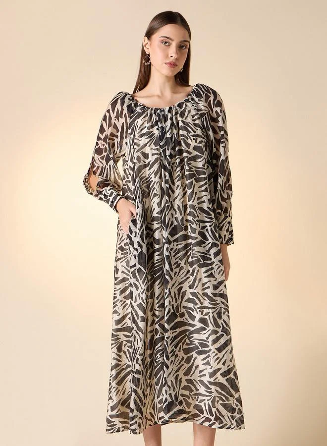 ايكونيك فستان ميدي شفاف مطبوع