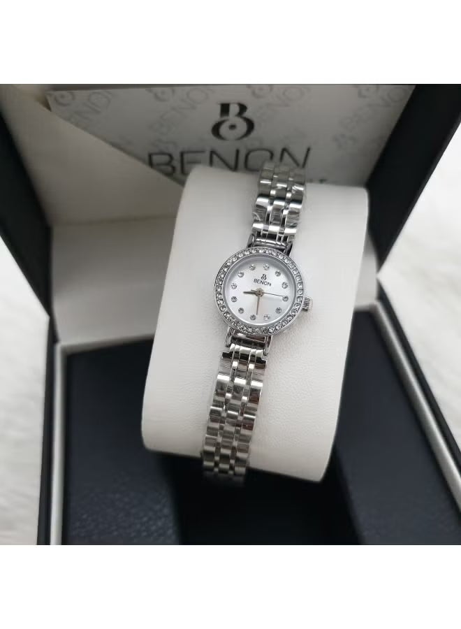 Elegant women's stainless steel wristwatch, modern and high quality, water-resistant, with a silver bracelet and white dial.