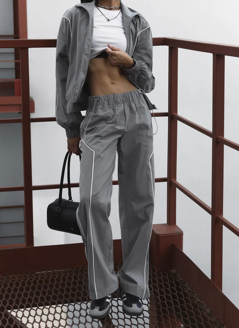 Lichi  Loose nylon trousers with contrasting stripes for Women | Best Price UAE