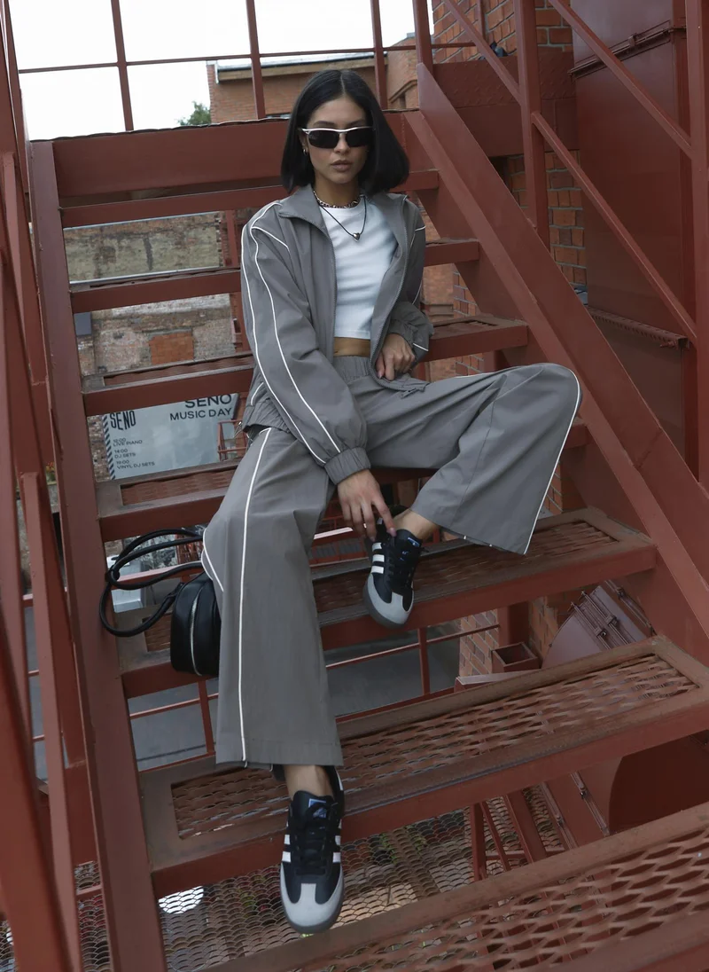 Lichi  Loose nylon trousers with contrasting stripes for Women | Best Price UAE