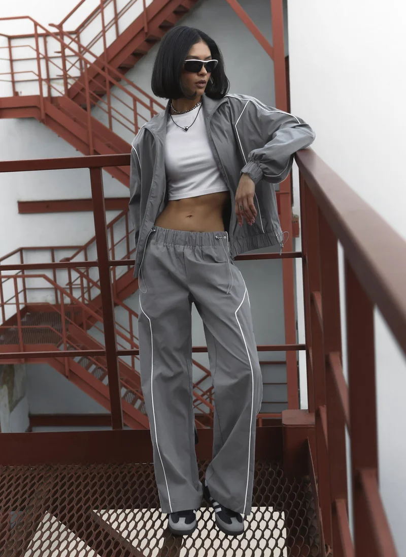 Lichi  Loose nylon trousers with contrasting stripes for Women | Best Price UAE