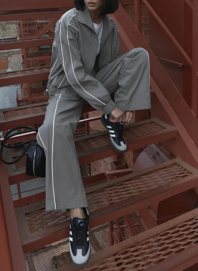 Lichi  Loose nylon trousers with contrasting stripes for Women | Best Price UAE