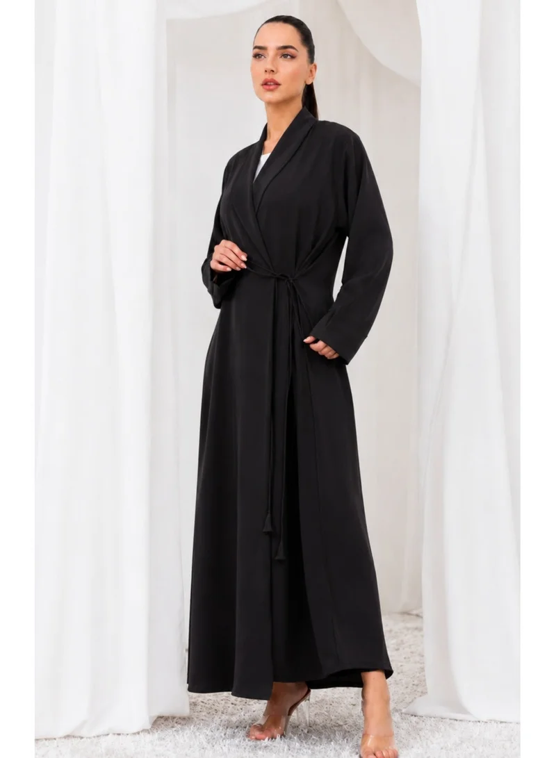 Nikias Overlap abaya on black crepe fabric with loop design on sleeves and front