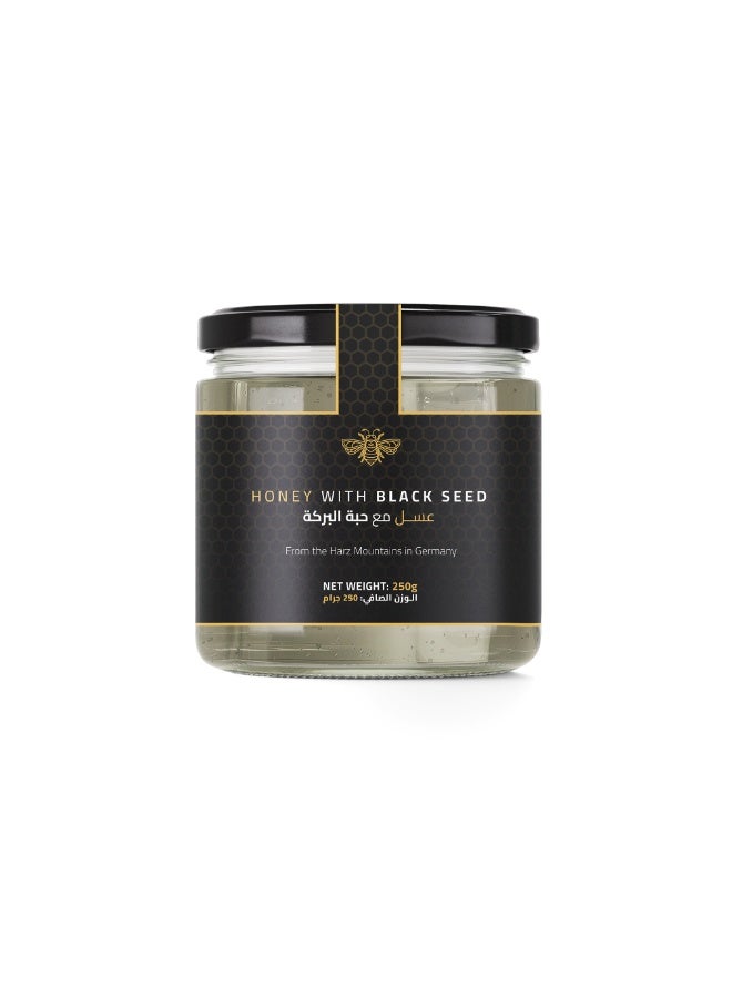 Honey with Black Seed 250g – A premium blend of 94% pure German blossom honey enriched with 2% black seed oil and 2% black seed powder for a naturally rich, aromatic, immune-boosting taste.