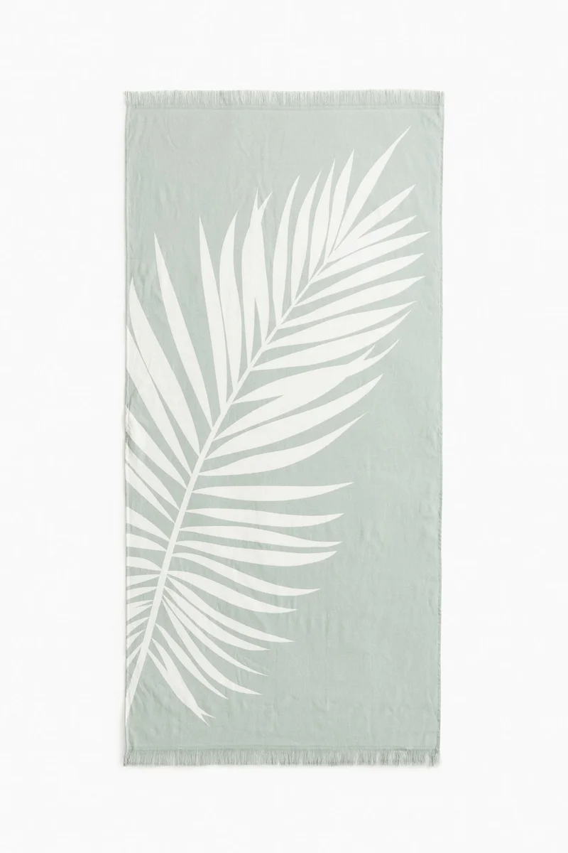 اتش اند ام منشفة شاطئ مزينة بشراشيب