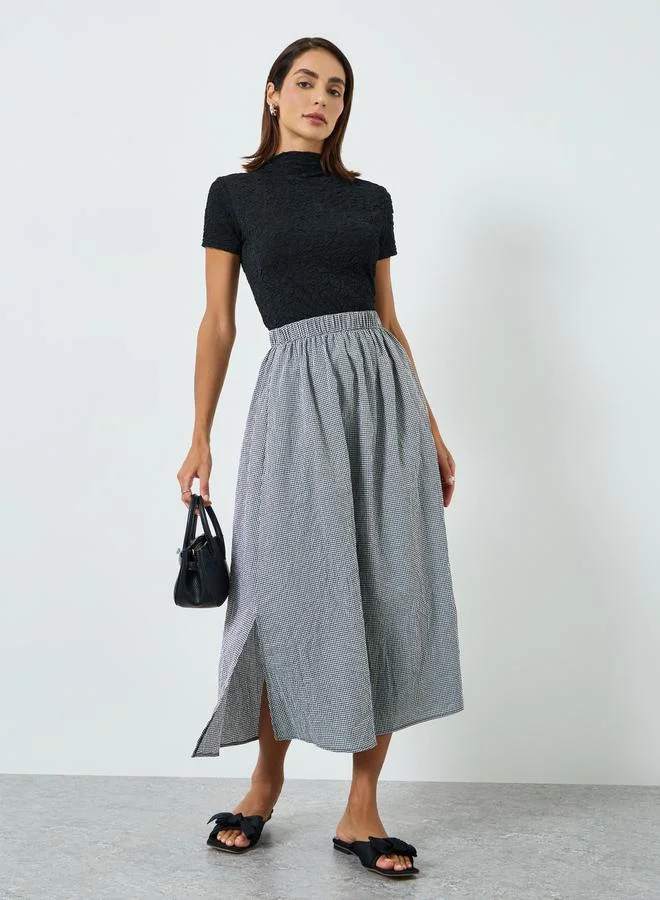 تايك تو تنورةة بحافة واسعة كاروهات وفتحة جانبية