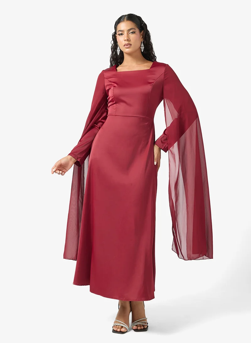 Dress With Exaggerated Slit Sleeves