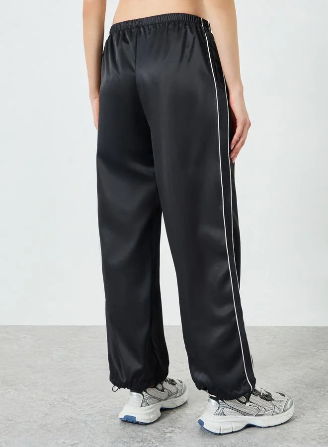 Styli Active  Black Dual Side Stripe Toggle Adjuster Straight Pants for Women | Best Price UAE