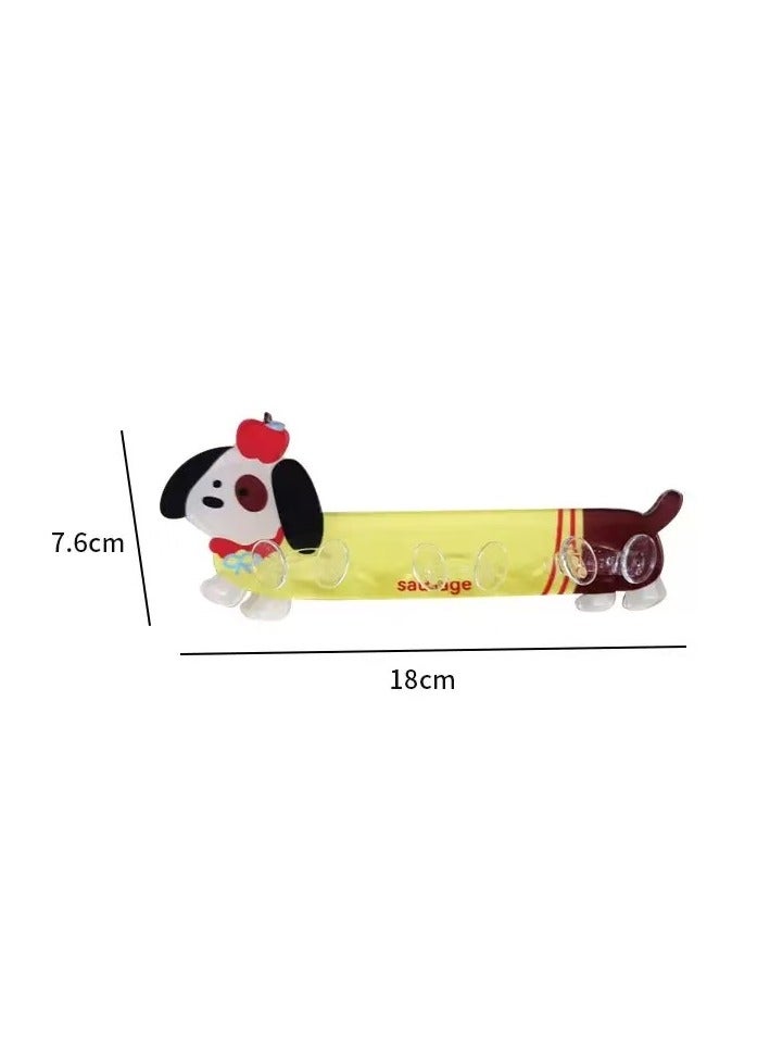 This adhesive hook can be used in the kitchen or bathroom. lt can hold three electrical plugs. lt is in the shape of a cute puppy. - Image 1
