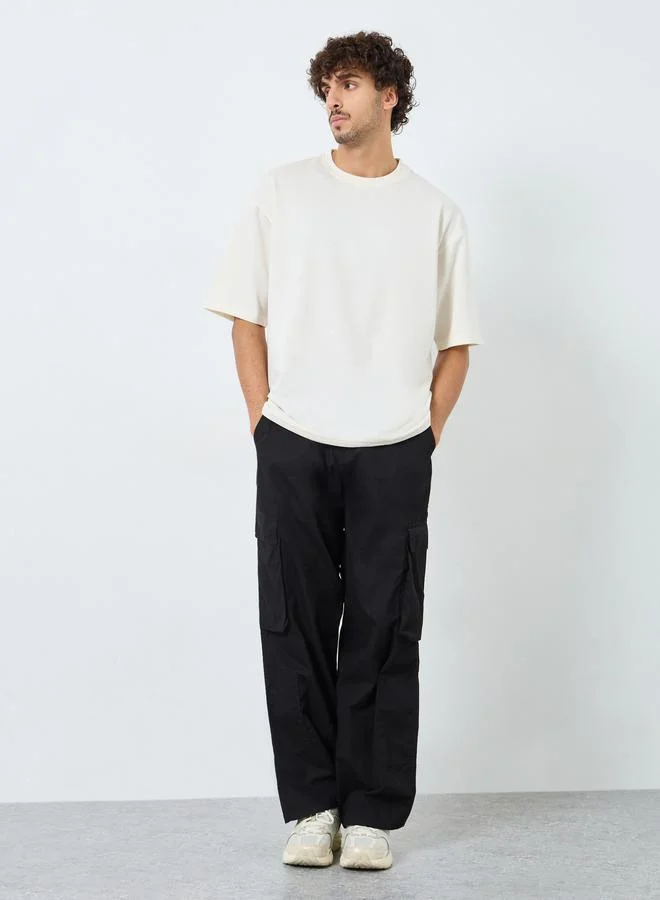 Styli Styli Men Cream Back Printed Terry Oversized T-Shirt