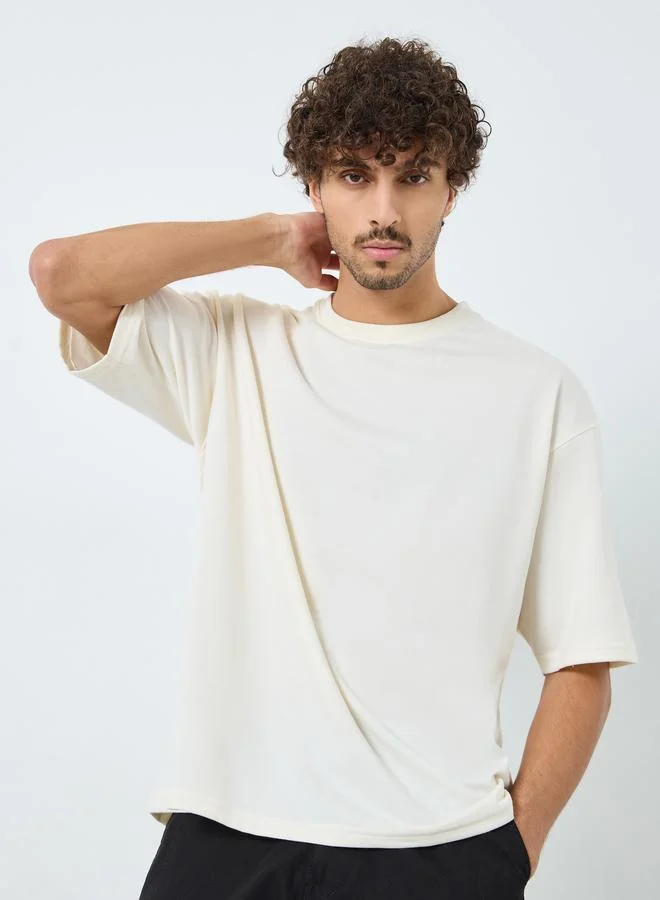 ستايلي تيشيرت تيري واسع بطبعة على الظهر