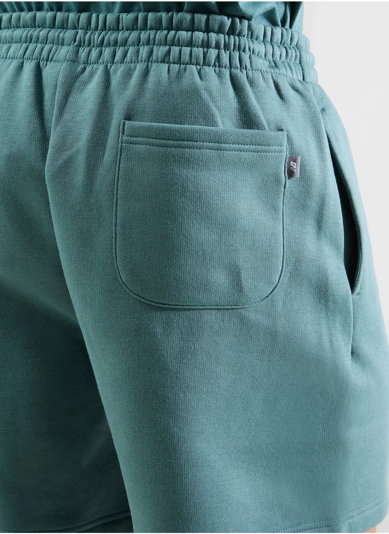 New Balance Sport Essentials Fleece Graphic Short 7"