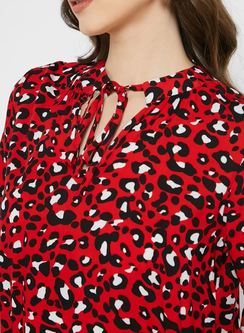 Ginger Shirred Neck Flared Cuff 
Tiered Printed Dress