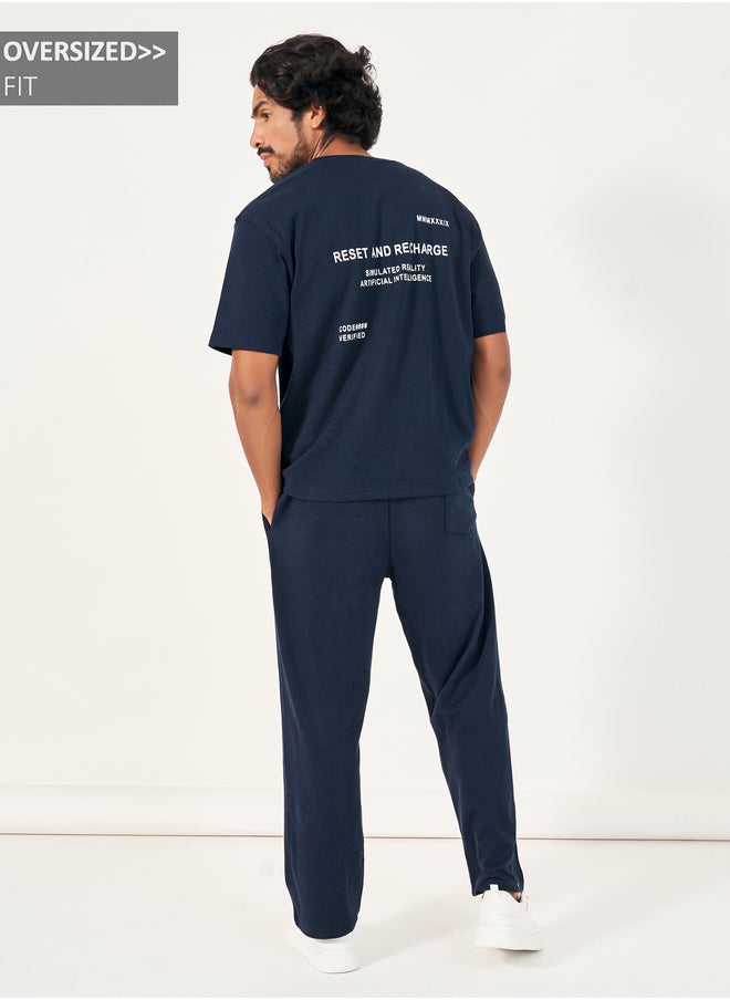 Styli Styli Back Print Oversized T-Shirt and Open Hem Interlock Joggers Co-Ords  - Image 1