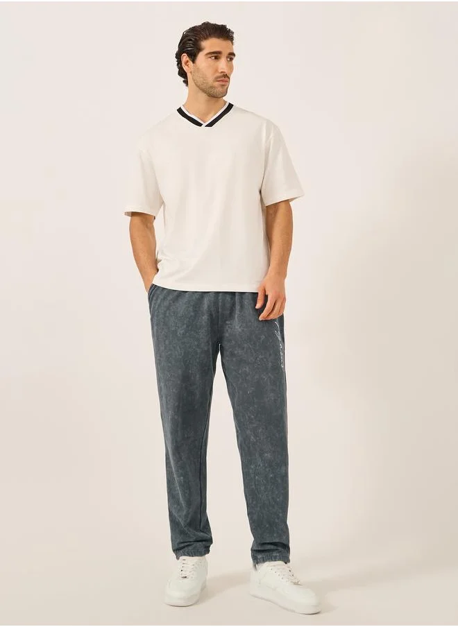 ستايلي Styli Acid Washed Slogan Print Slim Fit Terry Jogger