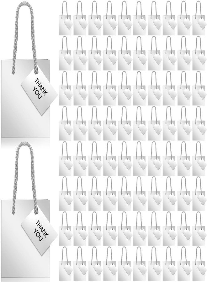 شير أكياس هدايا صغيرة من شير، عبوة من 100 كيس، أكياس ورقية بأبعاد 4 × 2.75 × 4.5 بوصة مع بطاقات، صناديق هدايا ورقية صغيرة جدًا بمقابض لأعياد الميلاد، وتوزيعات الحفلات، وحفلات الزفاف، والمشاريع الصغيرة (فضي) - Image 1