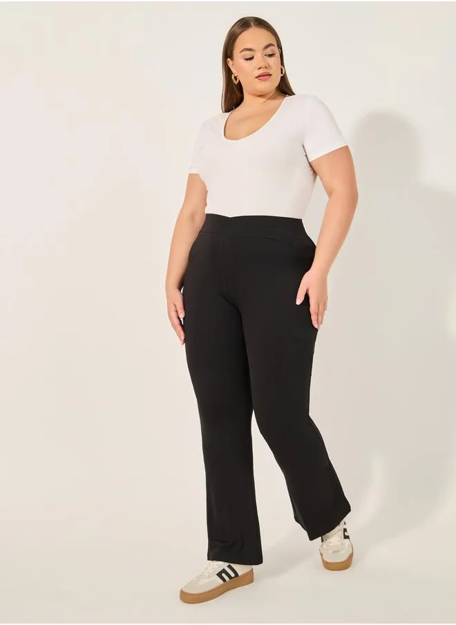 ستايلي Plus Size V Shaped Waistband Flared Leggings