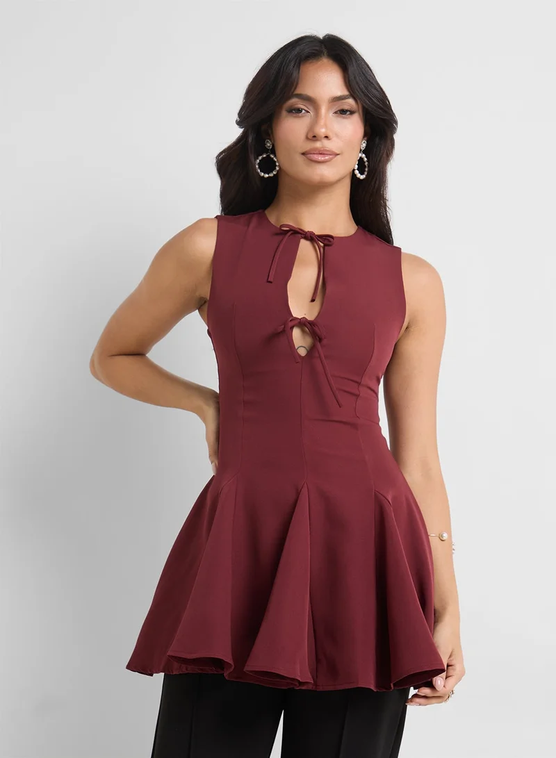 ELLA Peplum Top With Bow Tie Up