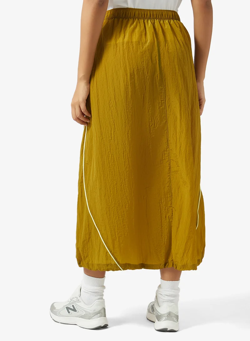 New Balance BASIL OIL (BIL) Legacy Skirt for Women | Best Price UAE