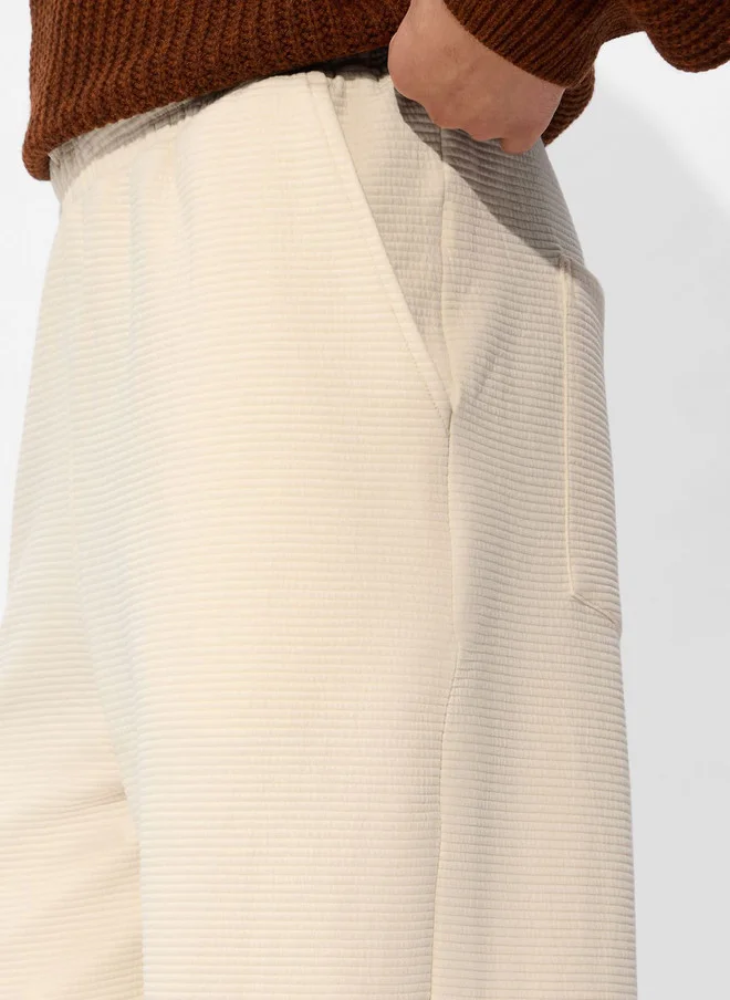 The Souled Store  The Souled Store Men Off-White Solid Cotton Straight Fit Joggers  | Best Price UAE