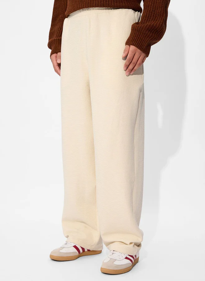 The Souled Store  The Souled Store Men Off-White Solid Cotton Straight Fit Joggers  | Best Price UAE