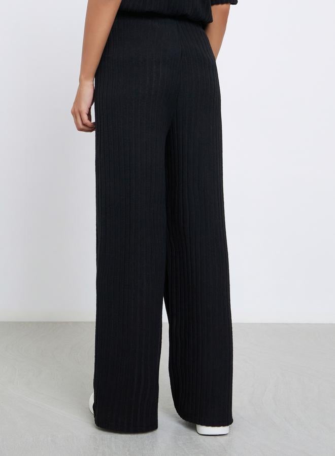 ستايلي بنطال محبوك بأرجل واسعة وتفاصيل مُضلعة - Image 4