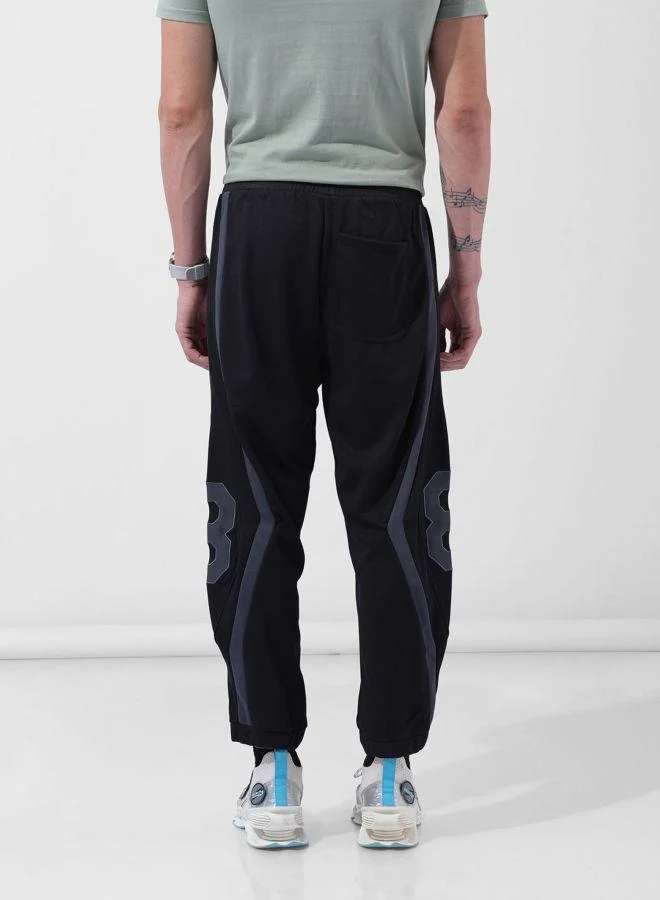 The Indian Garage Co Men Loose Fit Embroidered Side Pocket Mid-Rise Joggers