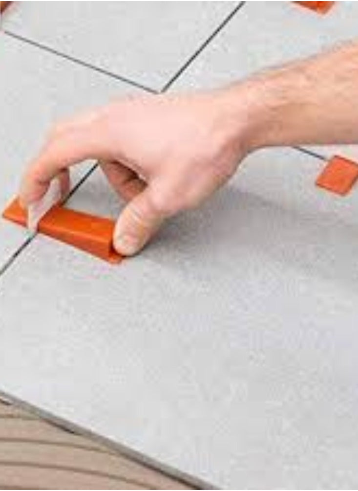 KNP - KNP Red Wedges Tile Leveling System Pack of 100 These systems are used to reduce lippage (uneven tile edges) and create a seamless finish in tiling projects. - Image 1