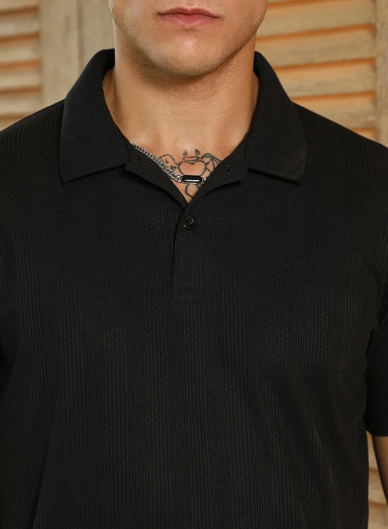 Campus Sutra Men's Onyx Black Ribbed -Tactile Polo T-Shirt For Casual Wear | Polo Neck | Short Cuffed Sleeves | Half-Button Closure | T-Shirt Crafted With Comfort Fit For Everyday Wear
