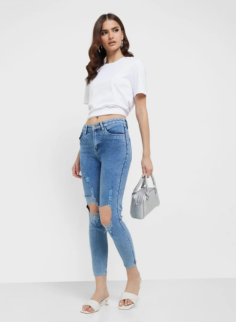 Ripped Mid Rise Skinny Jeans