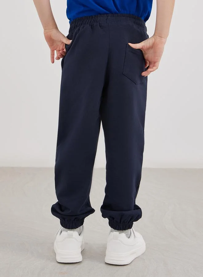 Styli Styli School Uniform Navy Blue Cotton Cuffed Joggers with Pockets