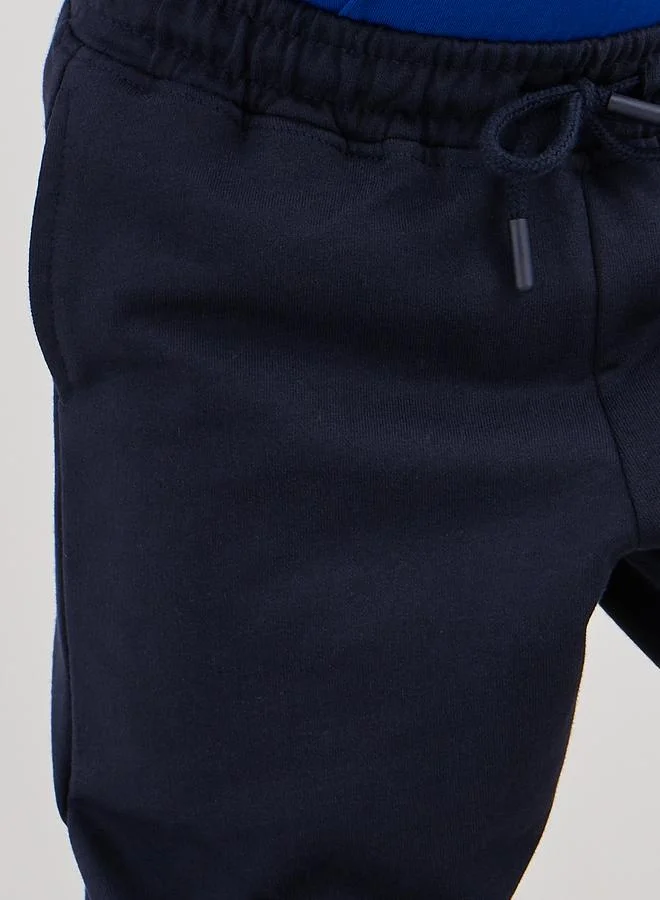 Styli Styli School Uniform Navy Blue Cotton Cuffed Joggers with Pockets
