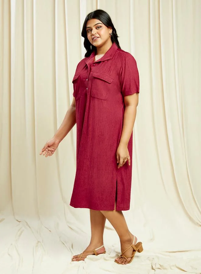 جلو باص فستان ميدي بمفاس كبير وأزرار