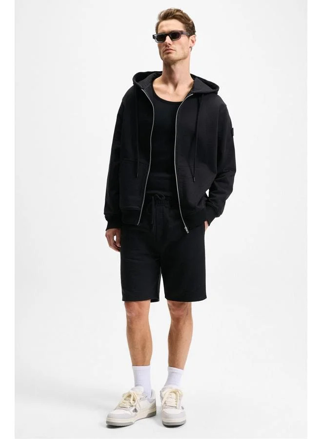 GRIMELANGE KEPA Men's Elastic Waist Pocket Relaxed Fit Black Shorts.