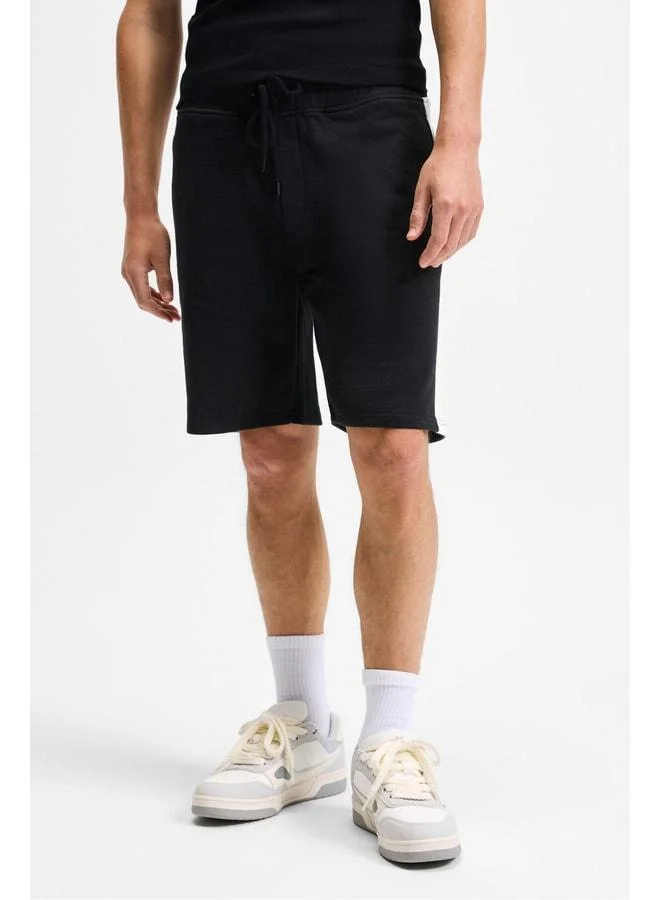GRIMELANGE KEPA Men's Elastic Waist Pocket Relaxed Fit Black Shorts.