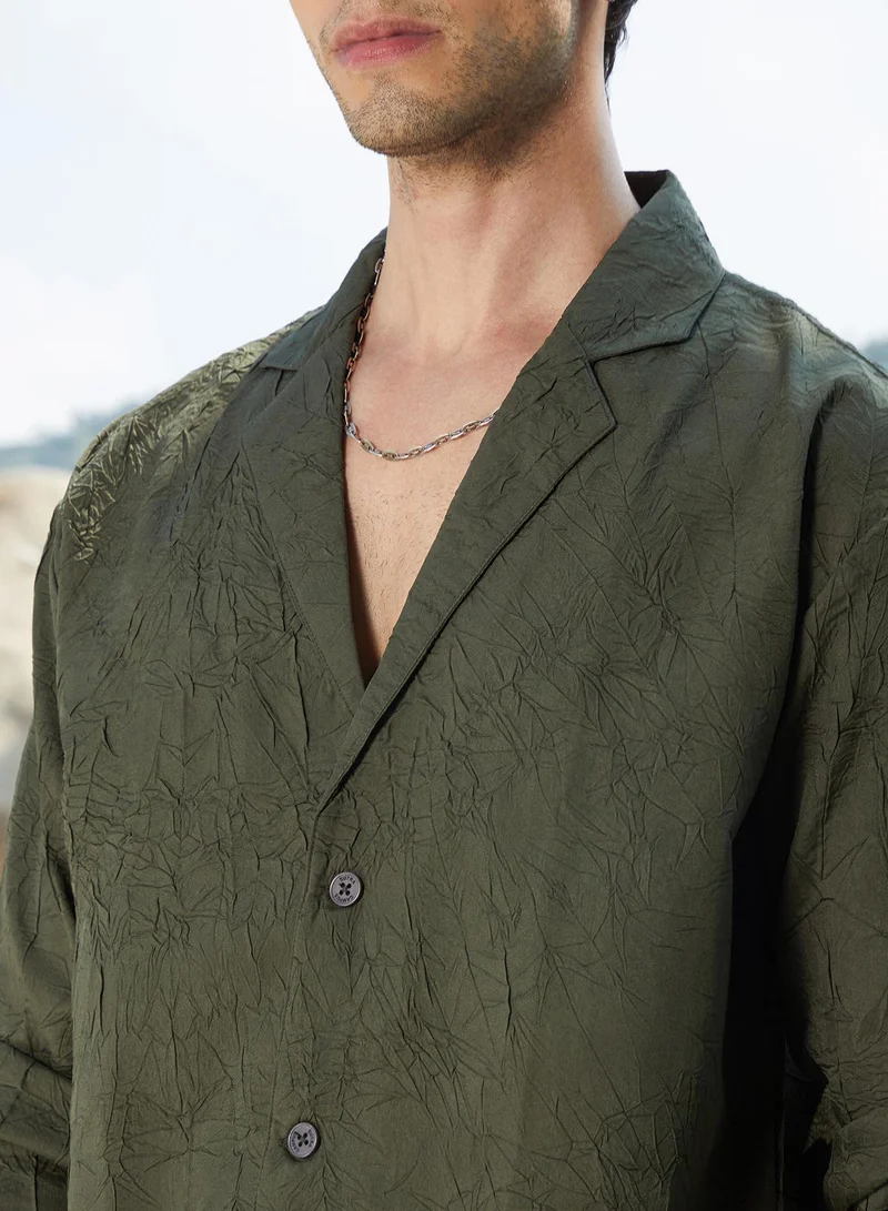 Campus Sutra Campus Sutra Men's Army Green Wrinked Korean Oversized Shirt For Casual Wear | Lapel Collar | Long Sleeve | Button Closure | Oversized Shirt Crafted With Comfort Fit For Everyday Wear