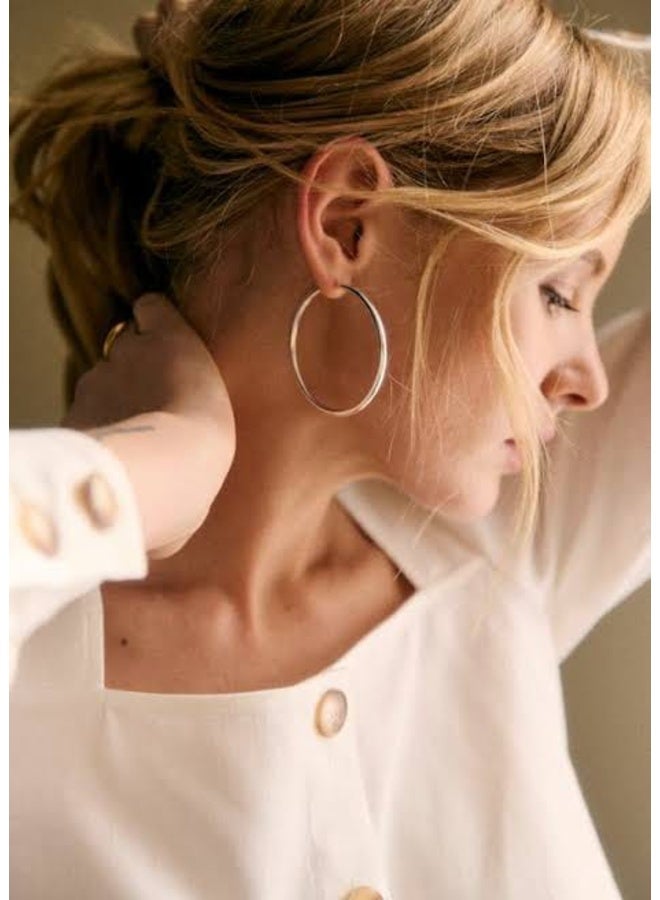 Luxuria Women's silver-tone hoop earrings, 4.5 mm in diameter, made of stainless steel. - Image 3