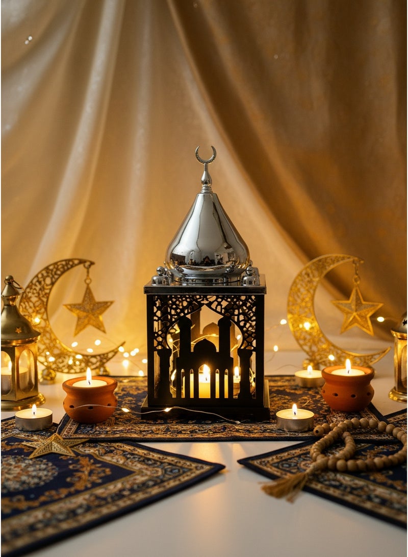 Living A lantern illuminated in an Islamic style, black in color, with a silver dome, measuring 35x14x14 cm. - Image 1