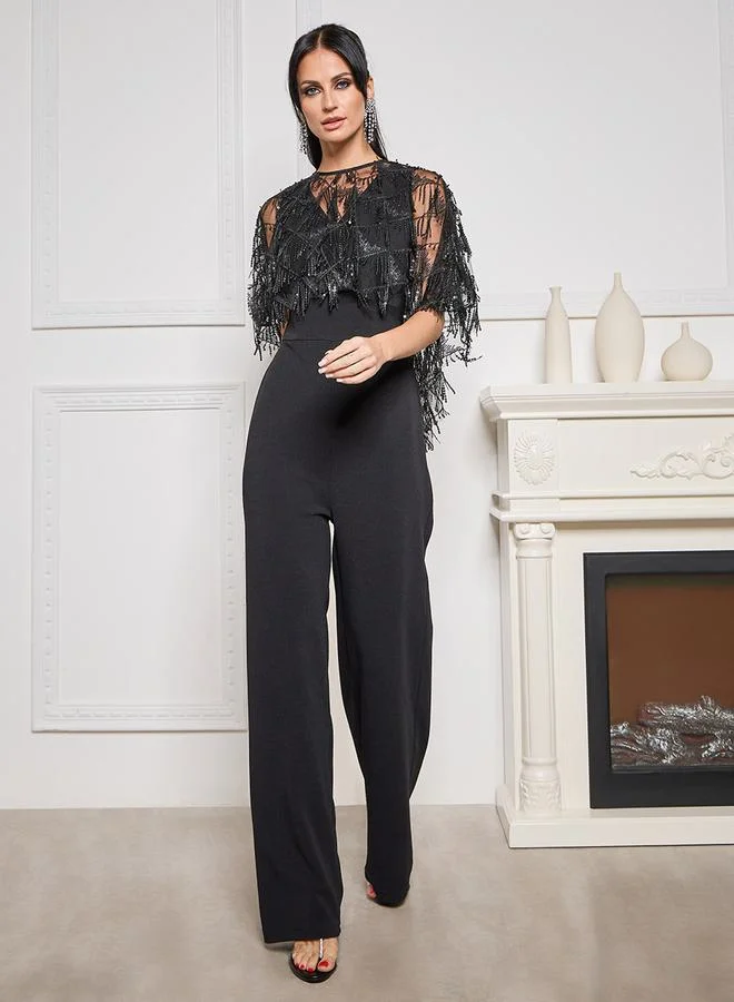 ستايلي V Neck Wide Leg Jumpsuit with Embellished Removable Cape