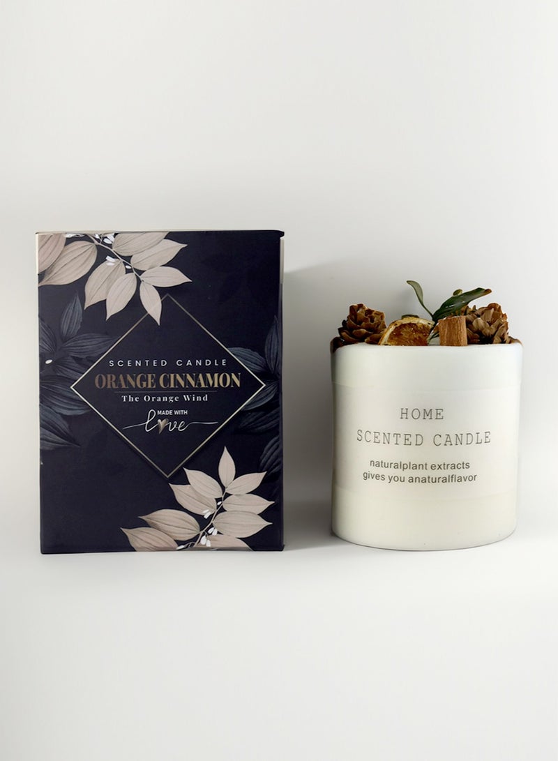 natural100 scented candle with orange slices and dried pine pieces