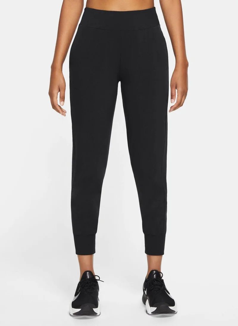 Nike Women's Dri-FIT Bliss Mid-Rise 7/8 Joggers