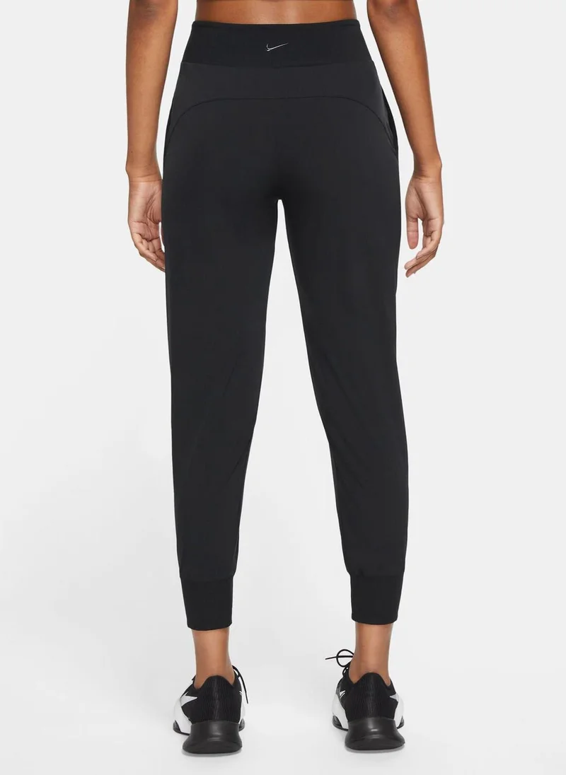 Nike Women's Dri-FIT Bliss Mid-Rise 7/8 Joggers