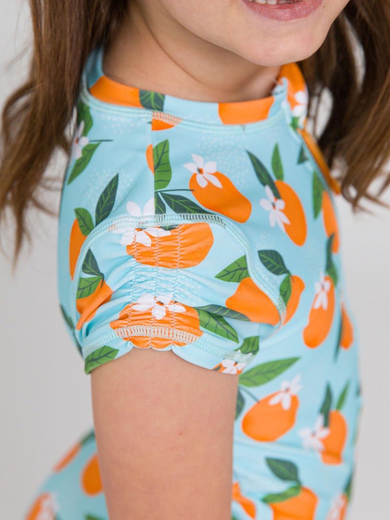 RuffleButts Girls UPF50+ Sun Protection Front Zipper Short Sleeve Rash Guard One Piece Swimsuit - Blue Orange You The Sweetest, 5 - Image 2