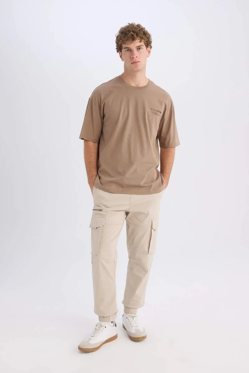 ديفاكتو Oversize Crew Neck Printed Short Sleeve T-Shirt