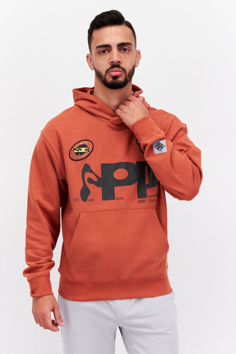 PUMA Puma x Perks And Mini Men Sportswear Fit Long Sleeve Outdoor Hoodie, Rust Brown  - Image 1